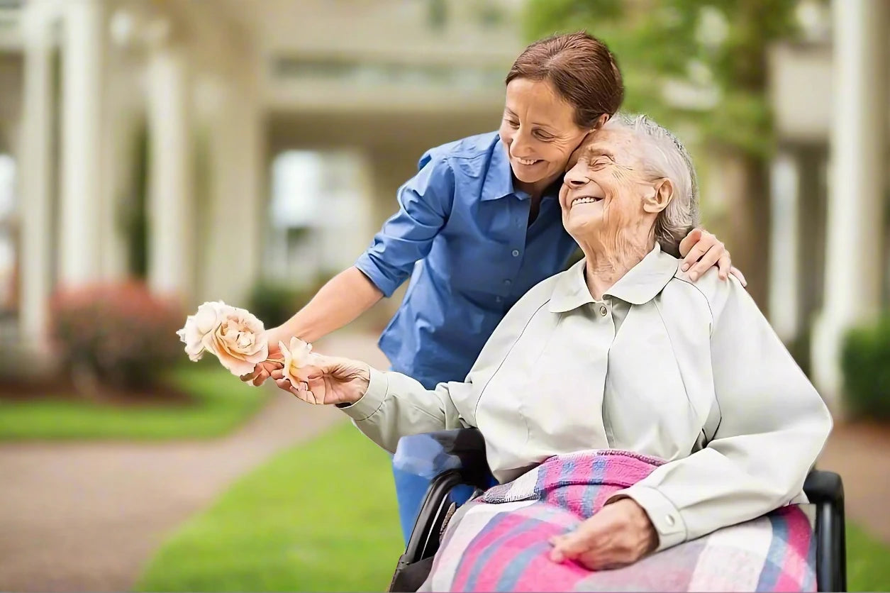 Elderly woman holding a flower